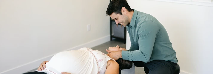 Dr. Andrew Murry adjusting a pregnant patient